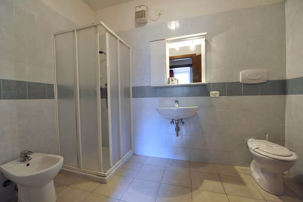 Badkamer in een appartement van Camping Bella Italia